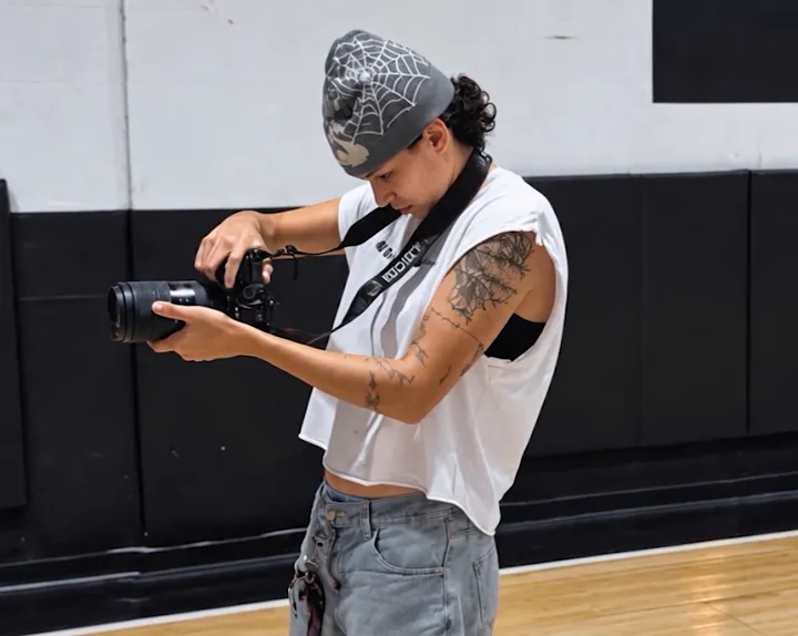 A Courtside photographer shooting a game courtside